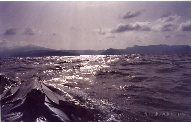 The bow is slashing through the waves off the coast of Amorgos island